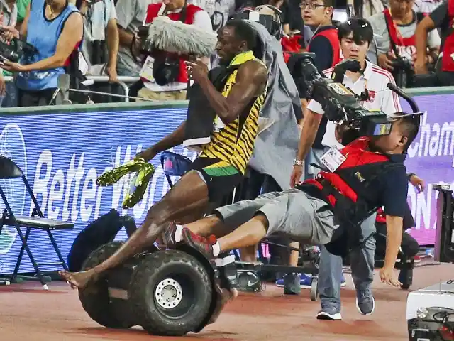 #11. Cameraman Crashes Into Bolt