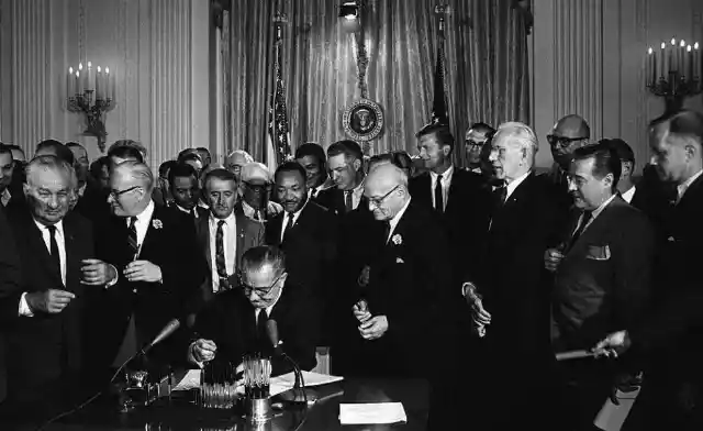 1964: Lyndon B. Johnson Signs The Civil Rights Act