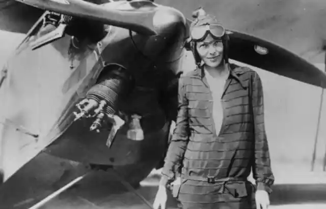 1928: Amelia Earhart With Airplane