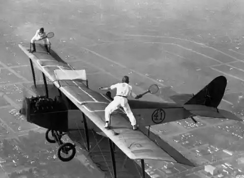 Daredevils Playing Tennis On A Plane